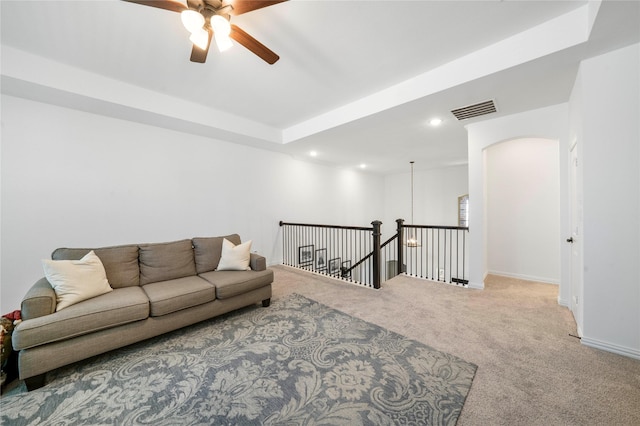 living room with visible vents, recessed lighting, carpet floors, arched walkways, and baseboards