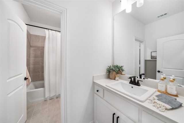 full bath featuring vanity, shower / bath combo, and visible vents