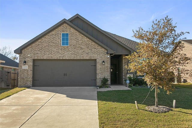 view of front of home with a garage and a front yard