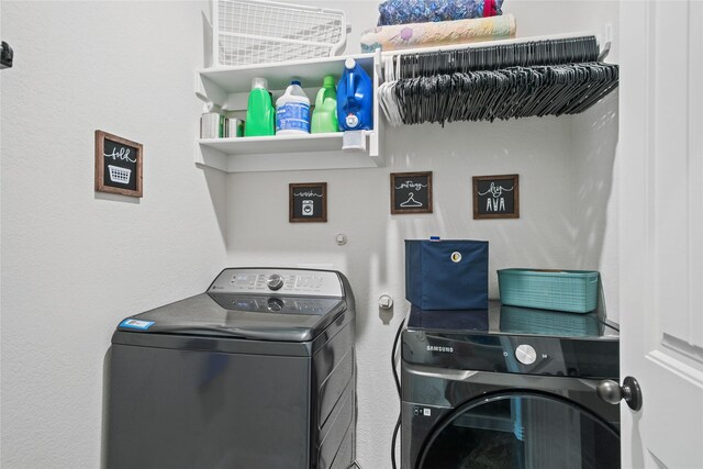 washroom featuring washing machine and dryer