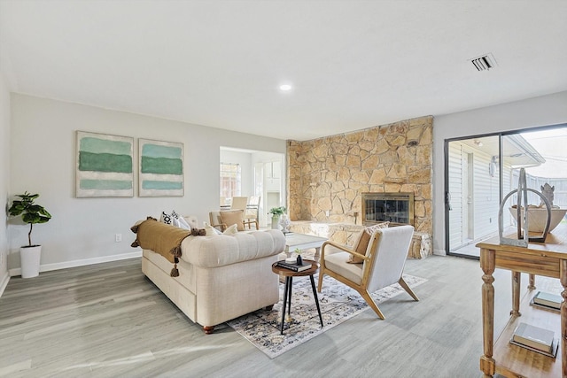 living room featuring a fireplace and hardwood / wood-style floors