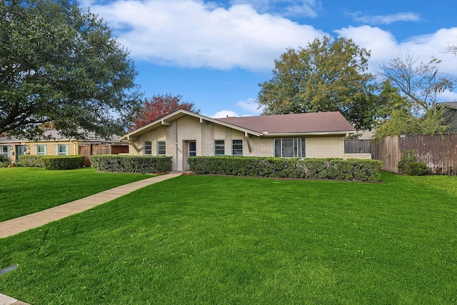 ranch-style house with a front yard