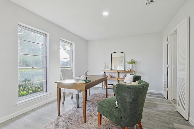 office with hardwood / wood-style flooring