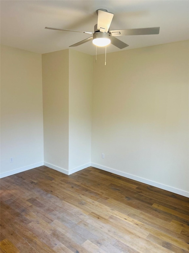 unfurnished room featuring hardwood / wood-style floors and ceiling fan