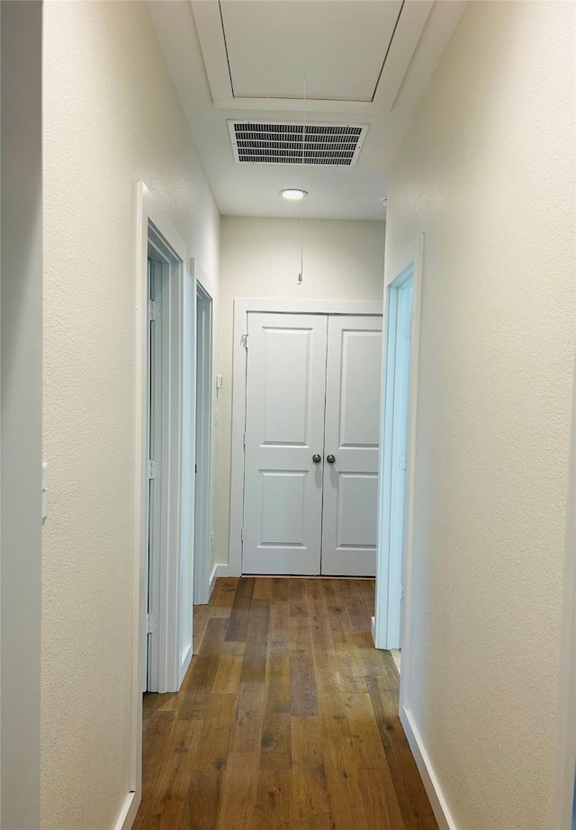 hallway featuring dark hardwood / wood-style floors