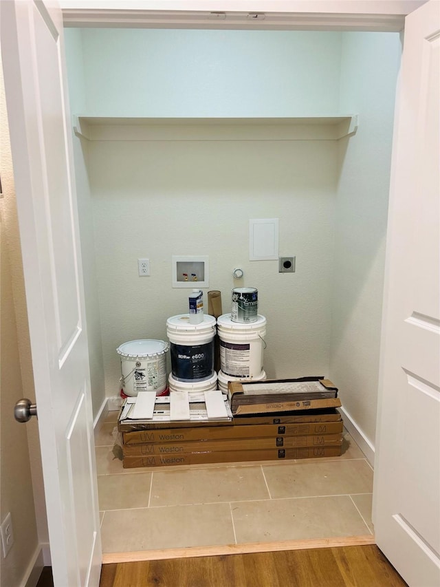 clothes washing area featuring hookup for a washing machine, wood-type flooring, and electric dryer hookup