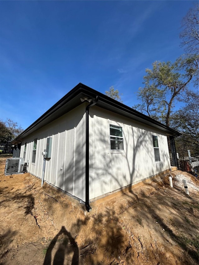 view of side of property featuring central air condition unit