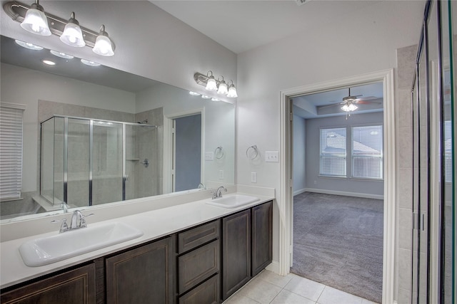 bathroom featuring vanity, tile patterned floors, and walk in shower