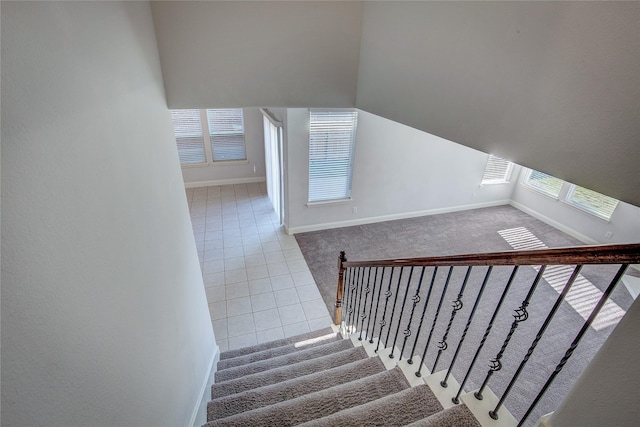 staircase with tile patterned flooring