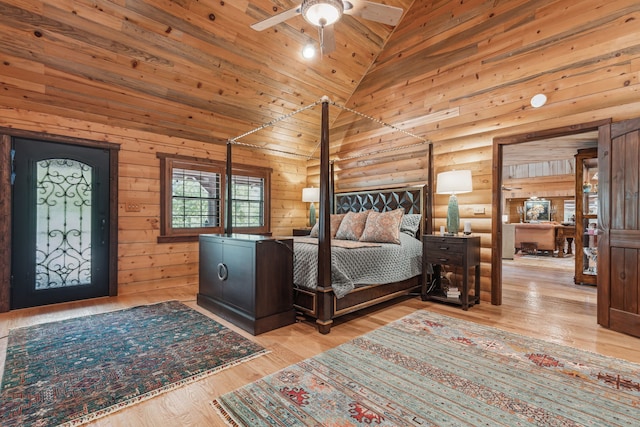 bedroom with high vaulted ceiling, wooden walls, ceiling fan, light hardwood / wood-style floors, and wood ceiling