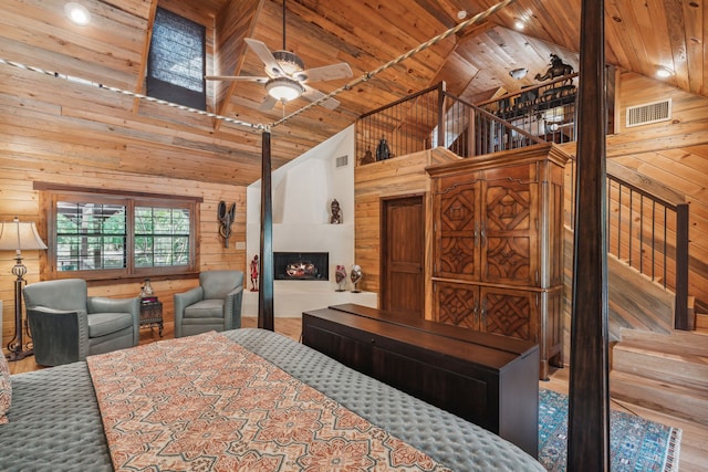 bedroom with a fireplace, hardwood / wood-style flooring, high vaulted ceiling, and wooden ceiling