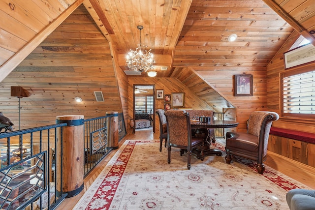 office area with wooden walls, light hardwood / wood-style floors, lofted ceiling, and wood ceiling