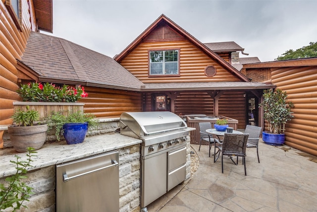 view of patio / terrace with area for grilling and exterior kitchen