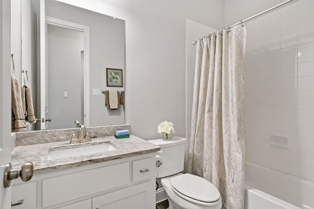 full bathroom featuring vanity, shower / bath combination with curtain, and toilet