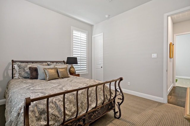 bedroom with wood-type flooring