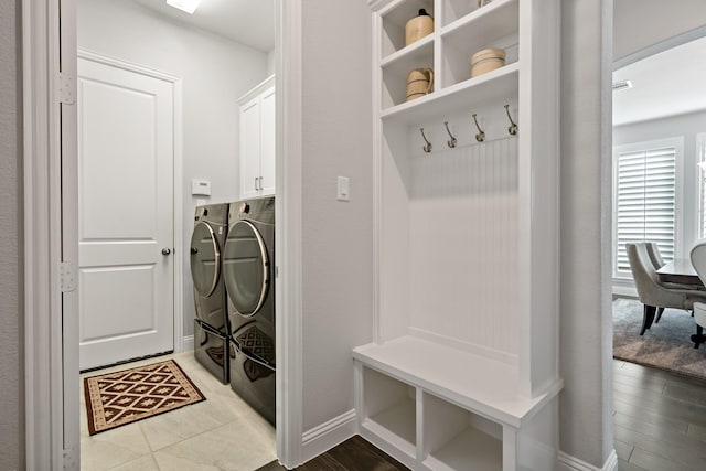 mudroom featuring wood-type flooring and washer and clothes dryer