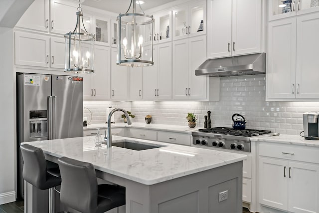 kitchen with white cabinetry, sink, a center island with sink, and appliances with stainless steel finishes