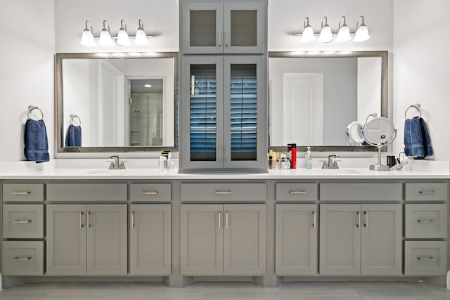 bathroom featuring tile patterned flooring and vanity