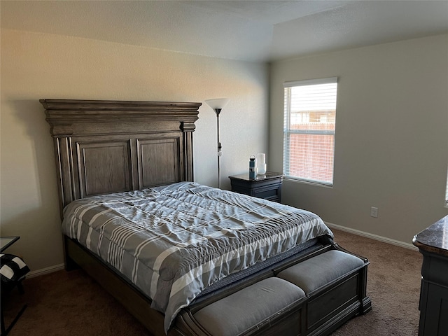 bedroom with dark colored carpet