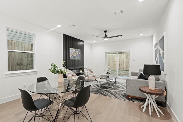 dining area featuring ceiling fan and light hardwood / wood-style flooring