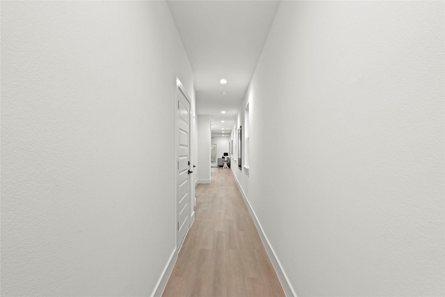 corridor featuring light hardwood / wood-style floors