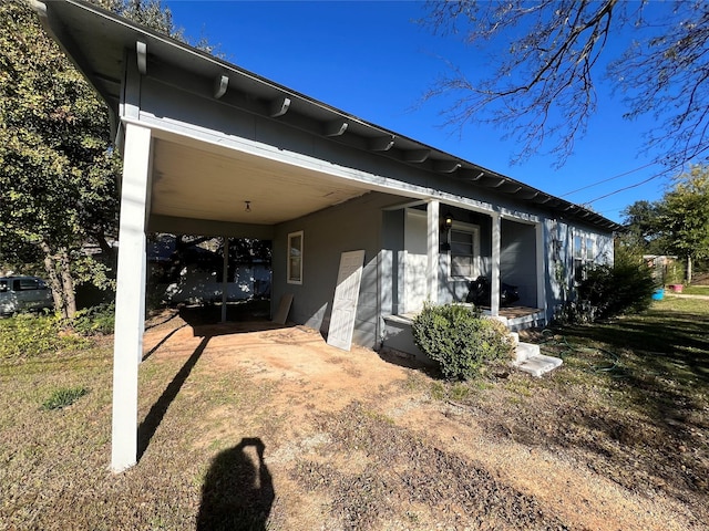 exterior space with a carport