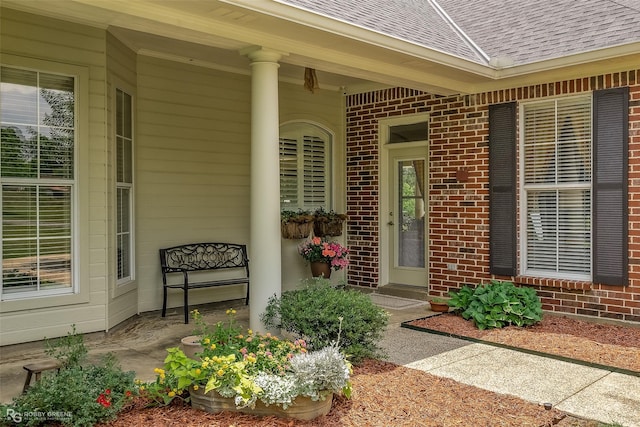 entrance to property featuring a porch