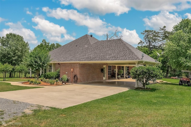 rear view of property with a yard