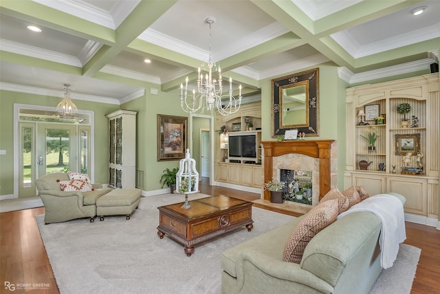 living room with coffered ceiling, beam ceiling, a high end fireplace, and a chandelier