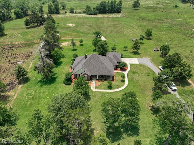 birds eye view of property with a rural view