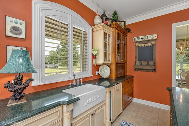 kitchen featuring sink, light tile patterned floors, ornamental molding, and a chandelier