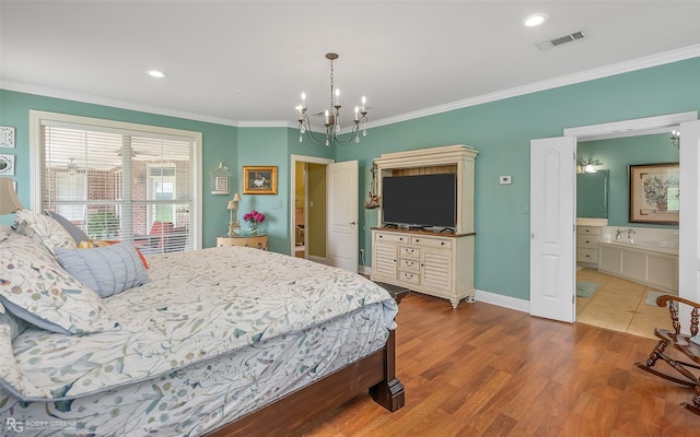 bedroom featuring connected bathroom, crown molding, a chandelier, and hardwood / wood-style flooring