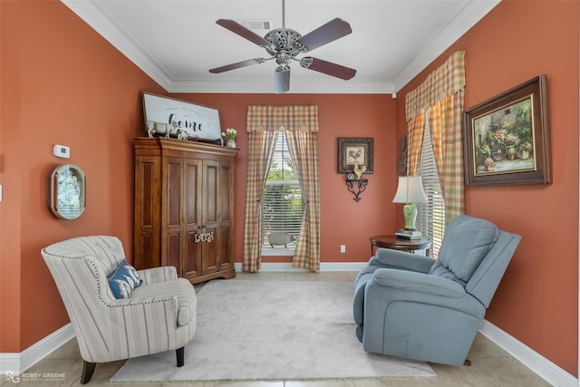 living area featuring crown molding, ceiling fan, and light tile patterned floors