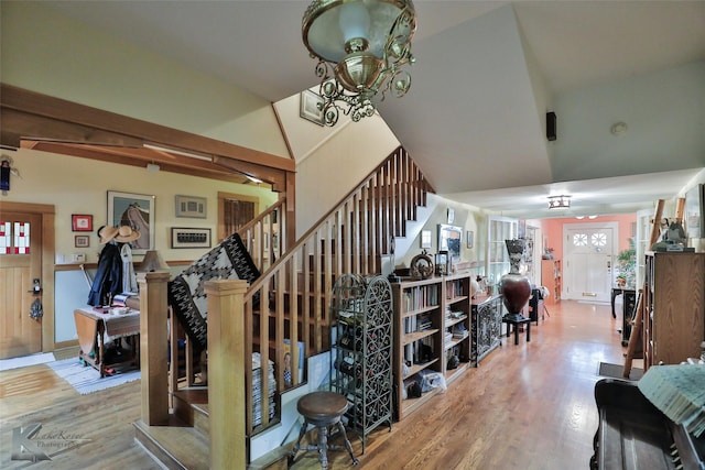 stairs featuring hardwood / wood-style floors