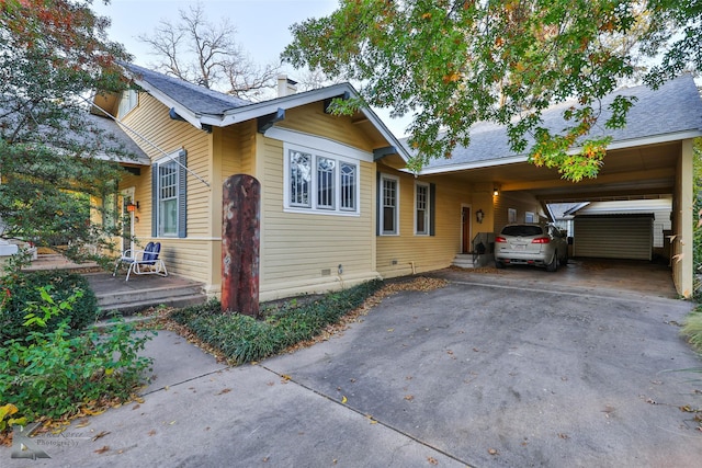 view of front of property featuring a carport