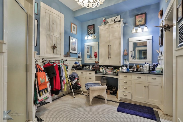 bathroom featuring tile patterned flooring and vanity