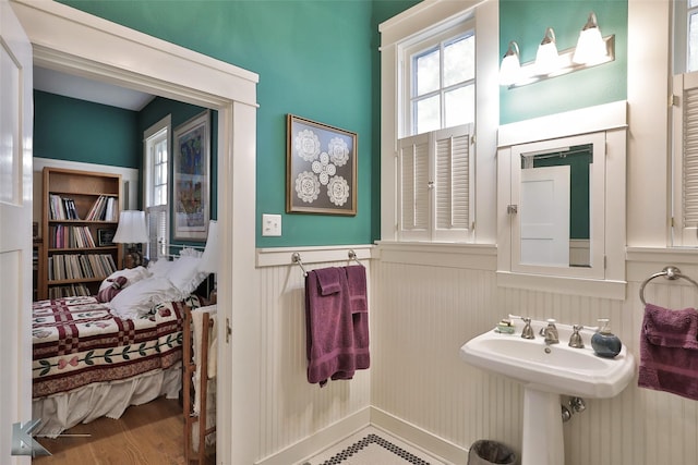 bathroom with hardwood / wood-style flooring