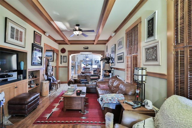 living room featuring ceiling fan, dark wood-type flooring, and beam ceiling