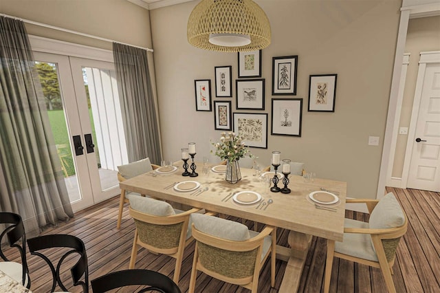 dining area with wood-type flooring and crown molding