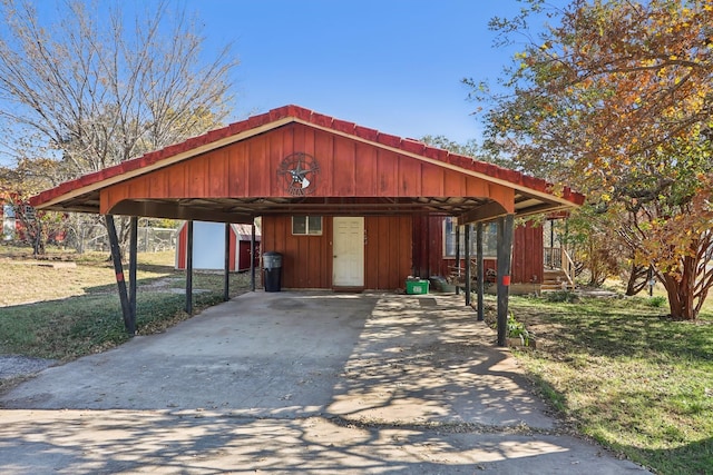 exterior space featuring an outbuilding and a front lawn