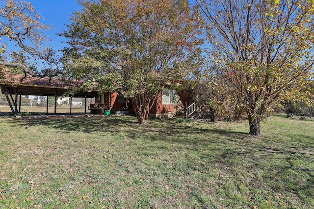 view of yard with a carport