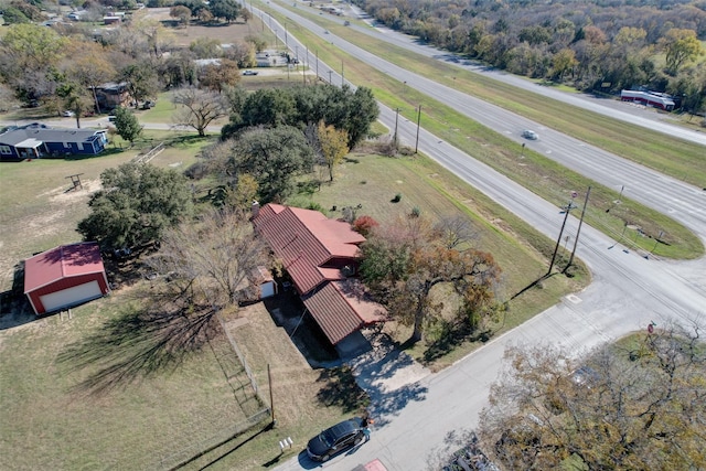 birds eye view of property with a rural view