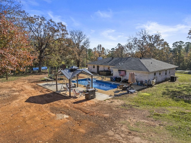 view of pool with a gazebo, cooling unit, and a patio area