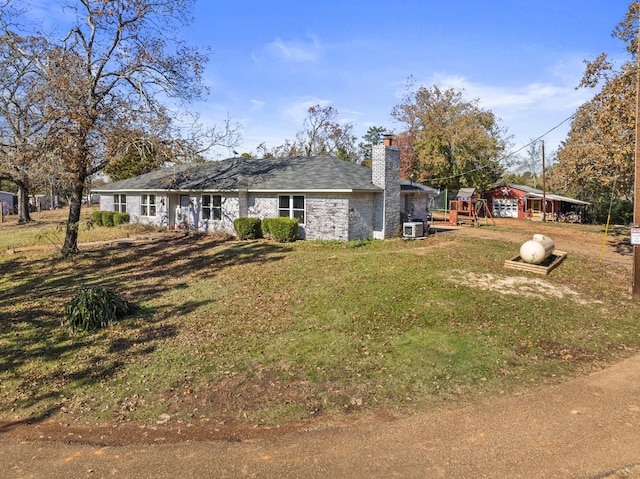 exterior space featuring central AC and a playground