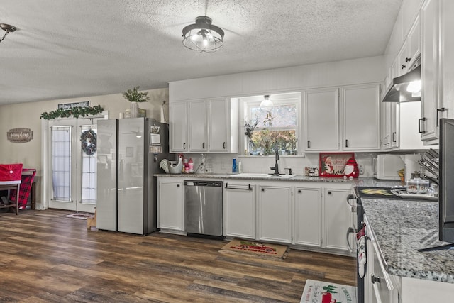 kitchen featuring stainless steel appliances, sink, white cabinets, and dark hardwood / wood-style floors