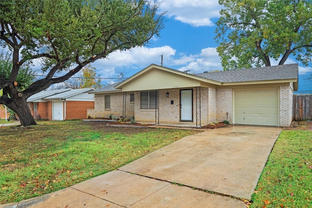 ranch-style home with a garage and a front lawn