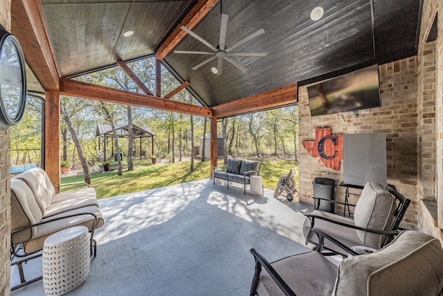 view of patio with a gazebo, an outdoor living space, and ceiling fan