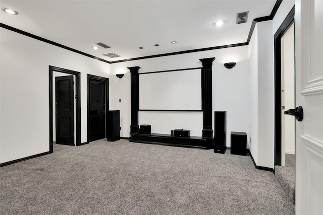 home theater with light colored carpet and ornamental molding