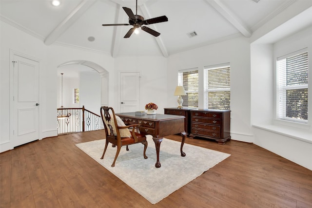 office area with ceiling fan, hardwood / wood-style floors, lofted ceiling with beams, and ornamental molding