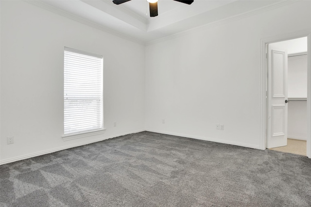 carpeted spare room with crown molding and ceiling fan